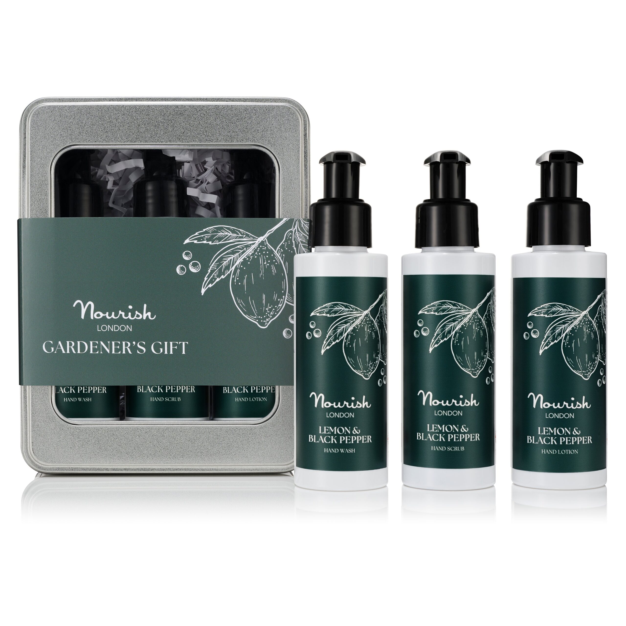 Silver tin gift set open displaying three black pump bottles alongside three individual bottles of hand wash, scrub, and lotion